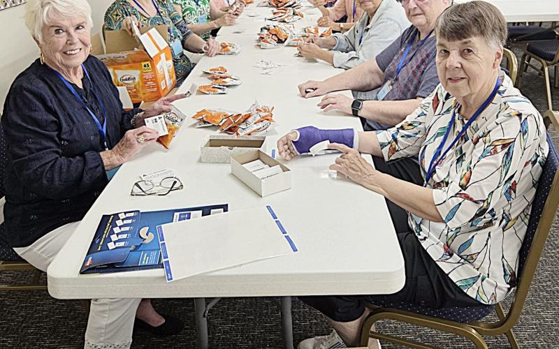 MARSP chapter members gather for a work-bee to prepare snack bags for distribution to all Gladwin and Beaverton Public School staff at one of their staff gatherings before school begins.