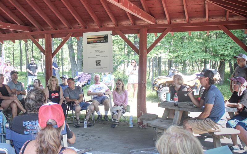 Pratt Lake Association President Jerry Canze addresses a meeting that drew over 50 members of the community to the Sage Township Pavilion Saturday morning to address concerns over the declining level of the lake.