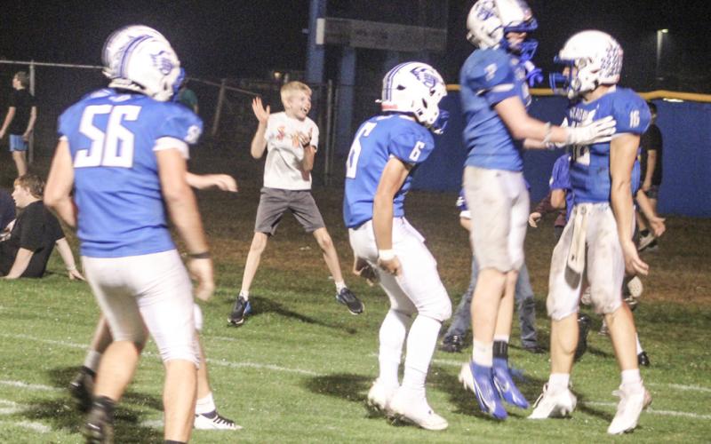 A short-lived celebration erupts in the end zone after Colton Pfenninger scored a touchdown in the fourth quarter Friday night.