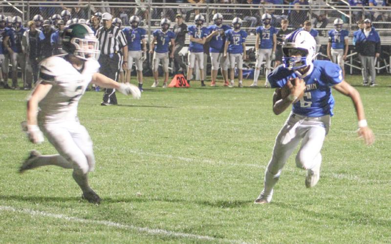 Gladwin’s Cruz Balcirak heads toward the end zone during the third quarter of Friday night’s loss to visiting Clare.