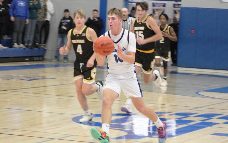 Jacob Pahl runs the floor during Gladwin’s 85-41 victory over Ogemaw Heights last Wednesday night. The sophomore made nine 3-pointers to break the school’s single-game record and finished with a total of 29 points.