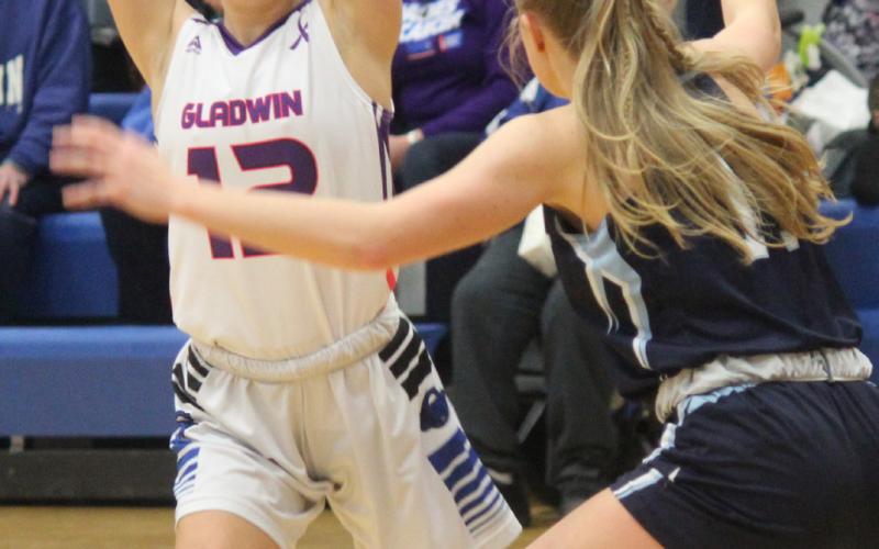 Gladwin’s Anna Seebeck is looking to make a pass during the game against Meridian.
