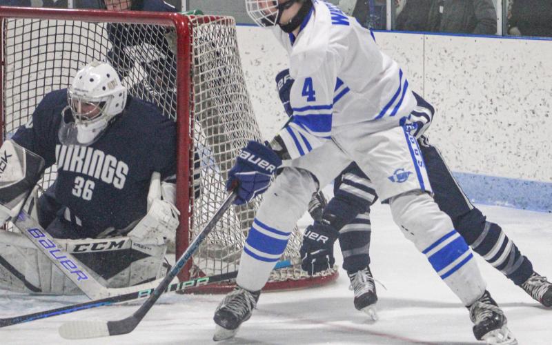 Gladwin’s Ike Wheeler looms dangerously near the Marysville net during Saturday’s wild 7-5 loss to the Division 1 Vikings.