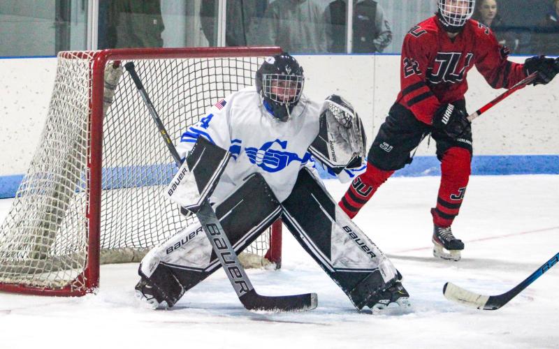 Sophomore goalie Preston Willert guards the cage for his first varsity victory during the Gladwin hockey team’s 4-2 victory over Jackson United Friday night.
