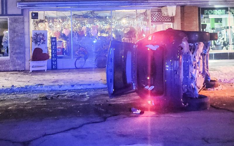 A Jeep Grand Cherokee flipped on its side after striking a parked car on Cedar Ave. last Tuesday night, shutting down traffic downtown for nearly two hours.