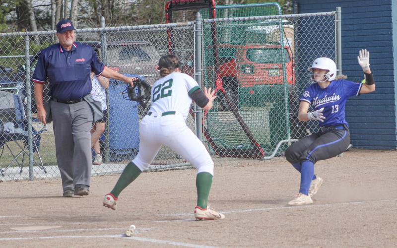 Gladwin’s Liz Winchester worked her way through a pickle and scored a run during the first inning of Thursday’s victory over Pinconning.