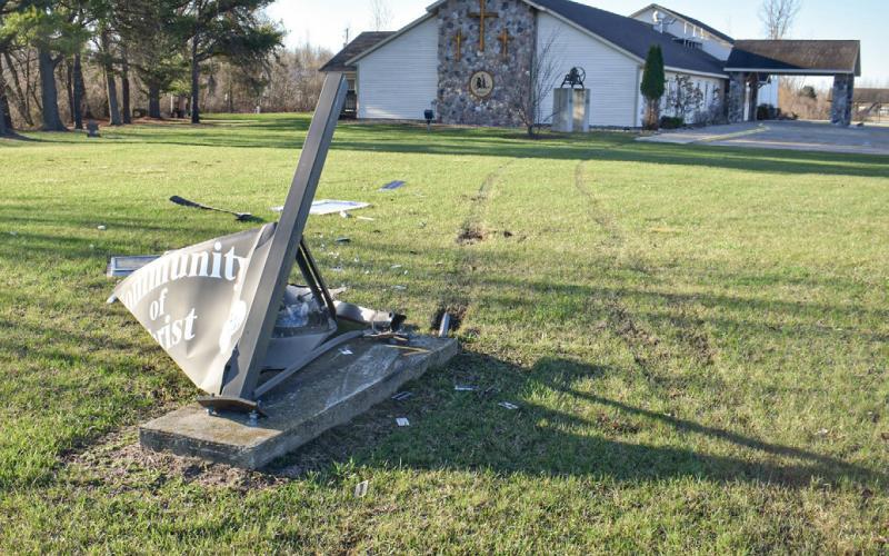 Tire tracks and the wiped out Community of Christ Church sign show the path of a vehicle that was involved in a crash with Sheriff Mike Shea last week.