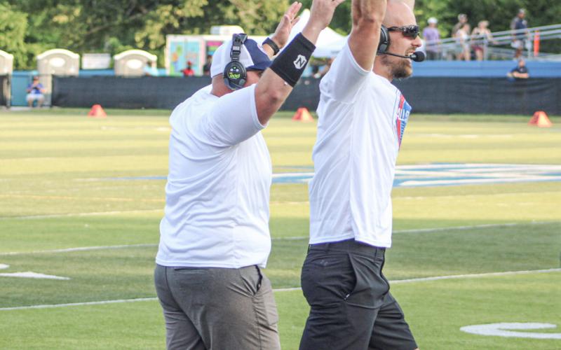 All of Gladwin’s representatives got in on the act Saturday when the West beat the East 35-13 in the Michigan High School Football Coaches Association All-Star Game at Lawrence Tech University. Defensive Coordinator Kody Emeott (left) coached the linebackers, Head Coach Marc Jarstfer celebrated a touchdown and defensive back Trace Corlew was in the pile for a tackle.