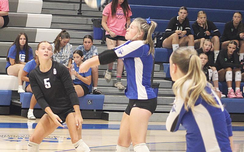 Gladwin’s Angelica Corlew passes a serve during last Wednesday night’s season-opening victory over Tawas.