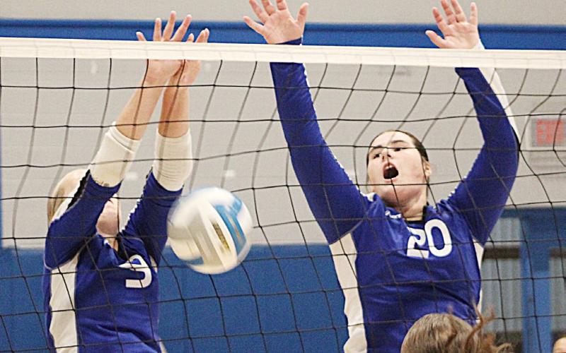 Chloe Mausolf and Leah Grove guard the net during Gladwin’s victory over Tawas last week.