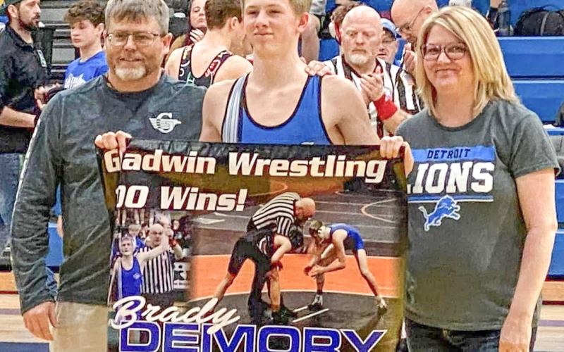 Gladwin’s Brady Demory enjoys some family time after posting the 100th victory of his wrestling career.
