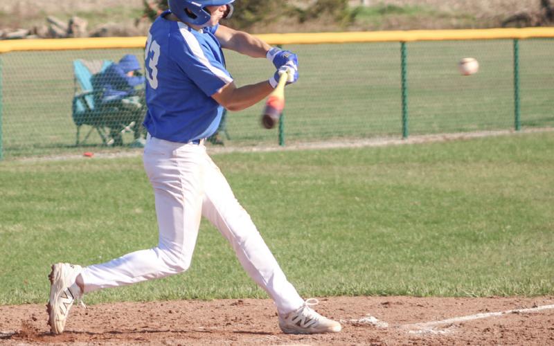 Gladwin’s Logan Walters takes a cut at a pitch during the season-opening doubleheader Friday at Pinconning.
