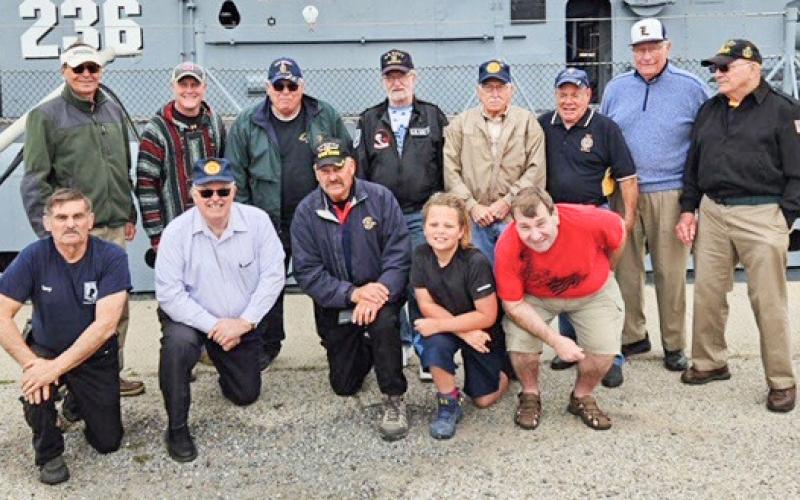 Shown in the photo, back row, left to right: John Mella, Dennis Tank, Mike Perry, Jeff Pitts, Jerry Allen, Bob Schafer, Terry Brokoff, Jerry Allen. Front row, left to right: Gary Rigg, Dr. Richard Bratton, Post 171 Commander Jim Volant, Dominic Holt, Tom Pero.