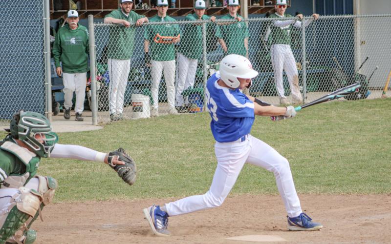 Gladwin’s Logan Walters takes a cut during the first game of Thursday’s doubleheader split with visiting Pinconning.