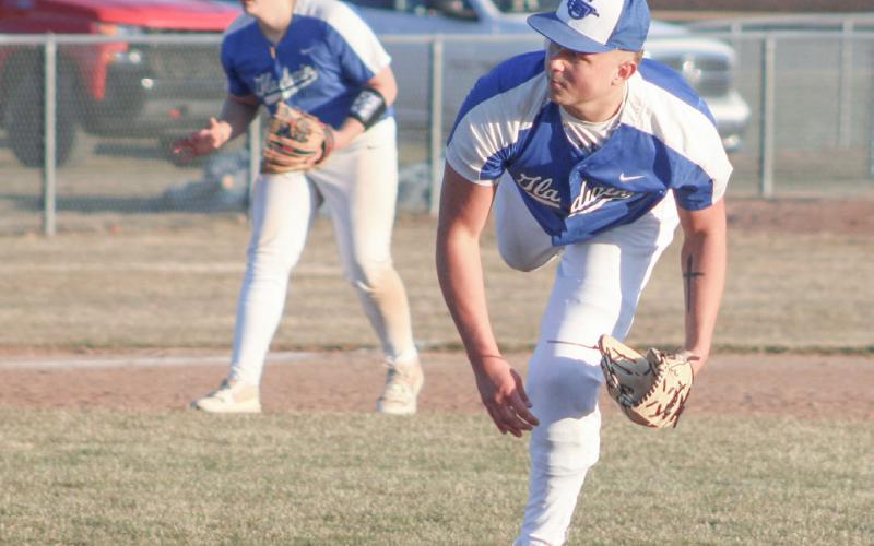 Gladwin’s Mason Meier follows through after delivering a strike during his first trip to the mound in two years Friday.