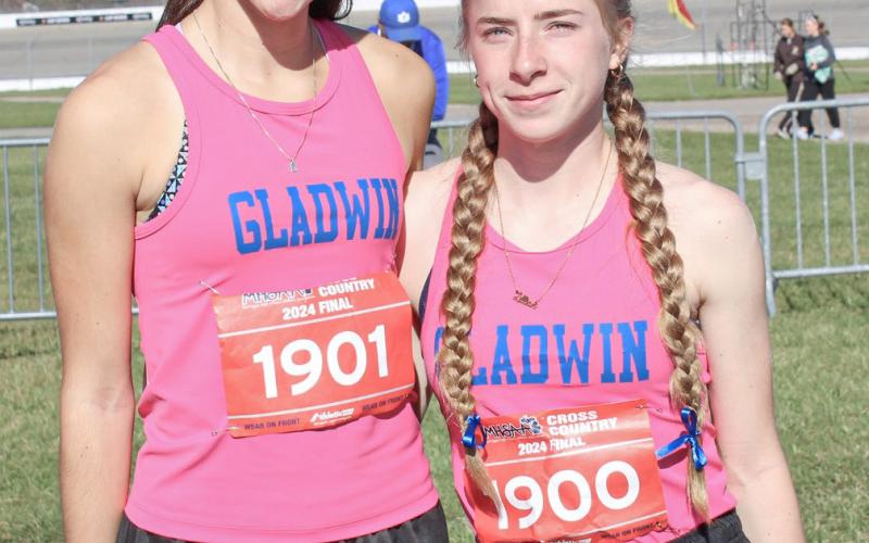 Abby Robinson (left) finished third overall and Lily Binger was fifth to earn First Team All-Conference honors in the Jack Pine Conference. Both runners went on to qualify for the state meet.