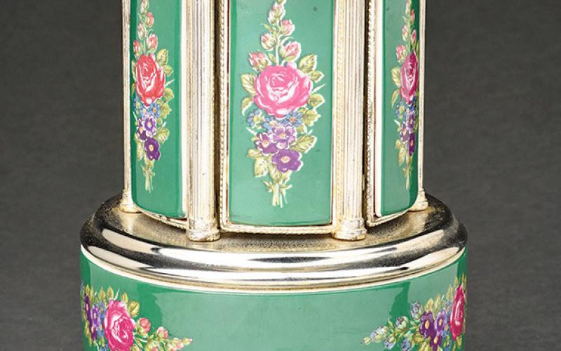 This musical cigarette dispender dates to the 1950s. KOVELS.COM