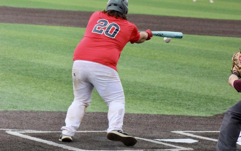 Gladwin American Legion Post 171 Lightning slugger Leland Love lays down a bunt during last weekend’s tournament.