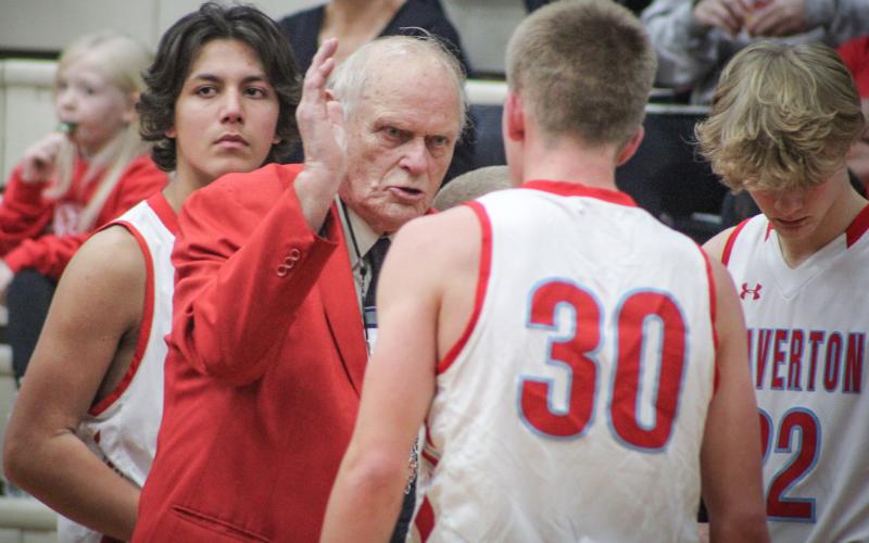 In the middle of the first game of his 50th season at the helm of the Beaverton boys’ basketball team, Beavers coach Roy Johnston makes a point to senior point guard Layk Woodruff. Beaverton beat Coleman 41-25.