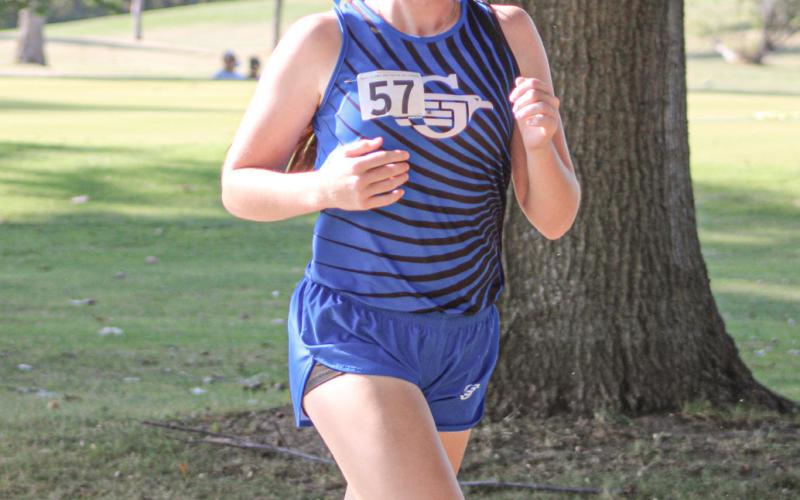 Alanis Povey competes at last week’s Jack Pine Conference jamboree. Povey was one of many Gladwin runners to post a season-best time Saturday at the Veterans Serving Veterans Invitational.