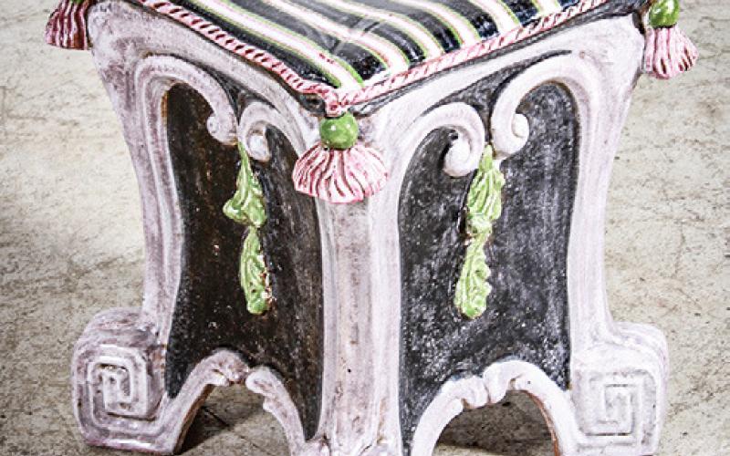 This majolica stool was made in the 20th century. It is square instead of the antique barrel shap but still shows the influence of the 19th-century style. BUNCH AUCTIONS