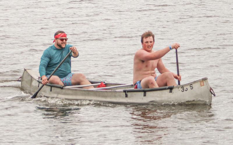 Gladwin father and son tandem Cory (left) and Max Barz reach the finish line at Ross Lake Park Saturday at the River Race of Two Cities.
