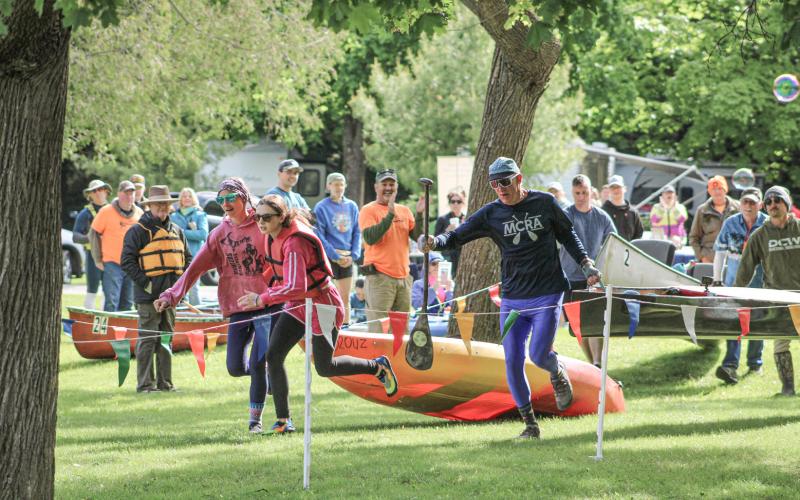 They’re off and running and heading for the bank at the beginning of the Gladwin County River Race of Two Cities Saturday morning at City Park.
