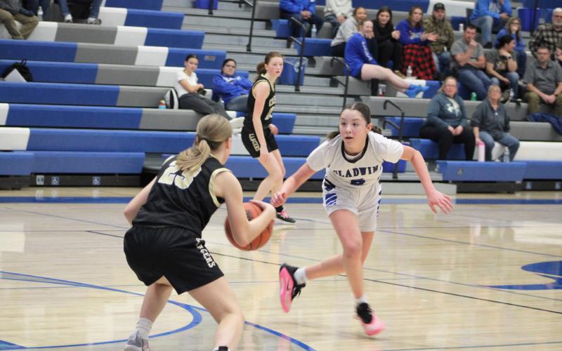 Freshman guard Liliana Gutierrez applies full-court pressure during Gladwin’s loss to visiting Bullock Creek Thursday night.
