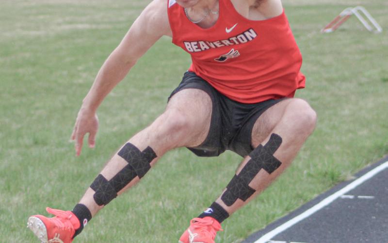 Beaverton’s Chayce Cazabon comes in for a landing in the long jump at last week’s track meet.