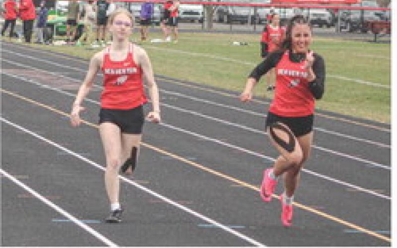 Jaelyn Giner races teammate Peyton Arndt to the finish line in the 100 meters at last week’s track meet at Beaverton.