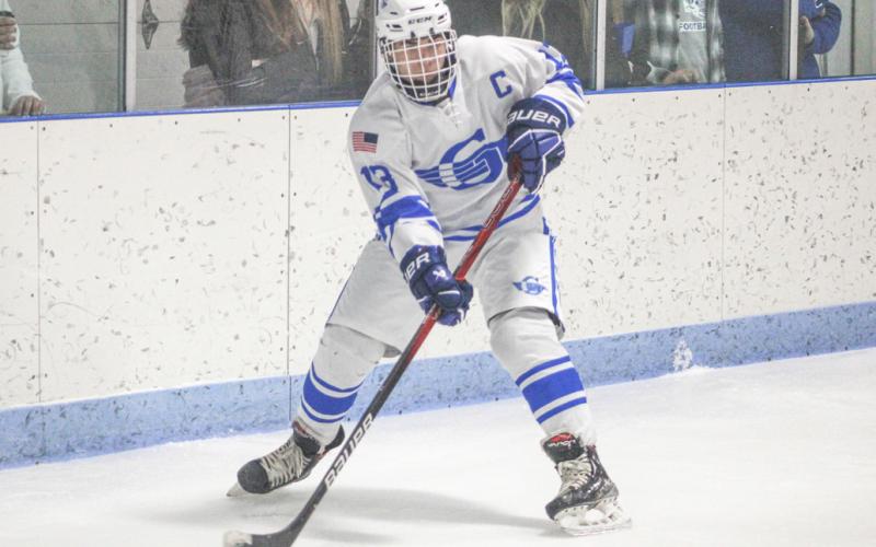 Returning defenseman Drew von Matt looks for an outlet from behind the net during a game last season.