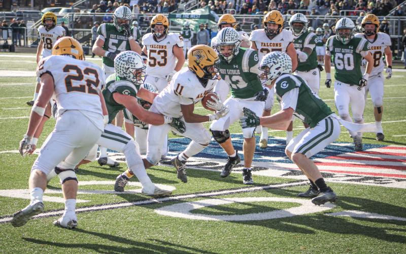 Ogemaw Heights’ Corie Kanitz fights through the line of scrimmage for some tough yards during Saturday’s Division 5 state semifinal loss to Grand Rapids West Catholic at Clare.