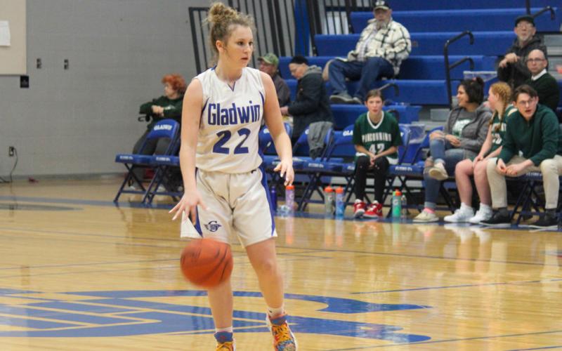 Gladwin’s Liz Winchester scans the court, looking over her options.