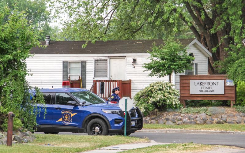 Early in the morning of June 6 a man was shot to death at 385 W. Brown St., at Lakefront Estates just west of downtown Beaverton. Police continue their active investigation into the matter. Pictured above: Michigan State Police Troopers block the entrance to the complex on Tuesday morning.