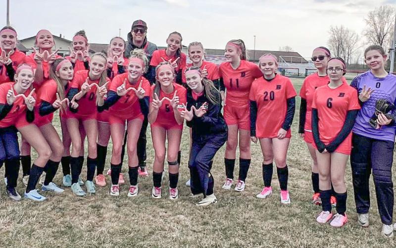 The Beaverton soccer team and coaches get together for a celebratory photo after winning for the first time in program history on Thursday.