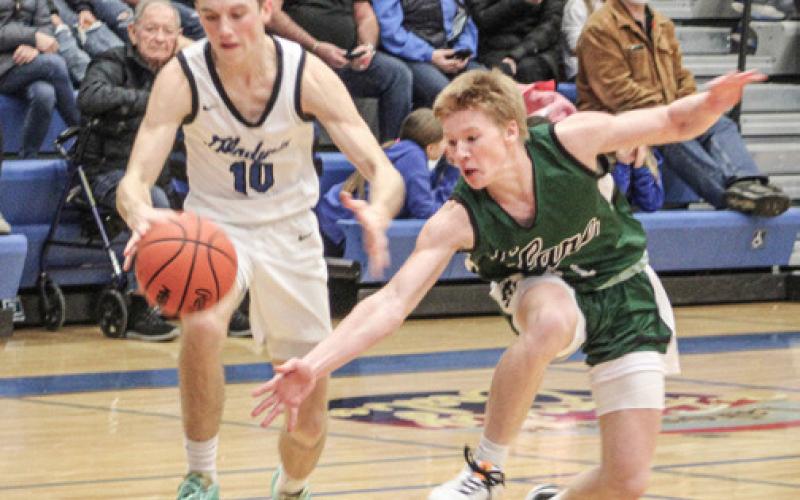 Seth Mead dribbles past a defender during Gladwin’s first meeting with Clare.