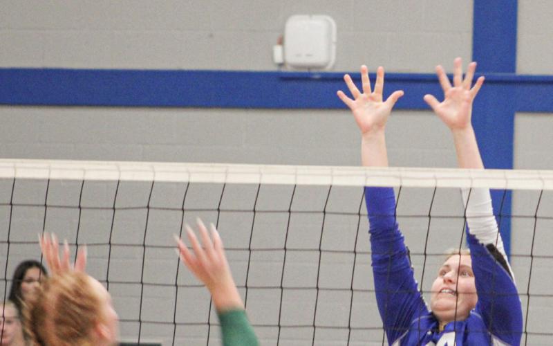 Gladwin’s Graycin Guoan goes up for the block during a recent match. The Flying G’s won twice last week and hope to close the regular season next week on a high note.