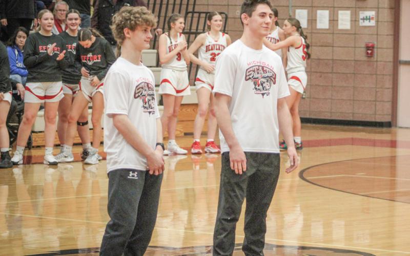 Beaverton All-State and All-Jack Pine Conference honorees Eric Larson (left) and Eli Roe were saluted prior to the girls’ basketball game last Wednesday.