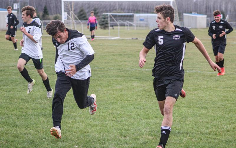 Logan LaBrosse, #5, attempts to get the ball through Bridgeport’s defense.
