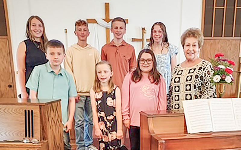 Pictured left to right: Ava Dennings, Jerimiah Balch, Jonah Griffiths, Oriana Lewis, Koen Allen, Lily McLaren, Remy Allen, and Ms. Sherrie.