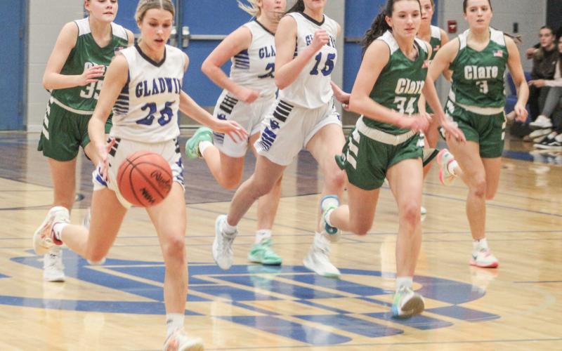 Gladwin’s Breanna Campbell leads the way across the time line on the fast break during Friday night’s 44-36 loss to visiting Clare.