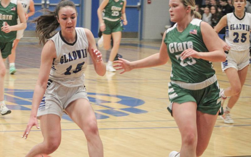 Gladwin’s Ava Gary dribbles into the paint during Friday night’s battle with visiting Clare.