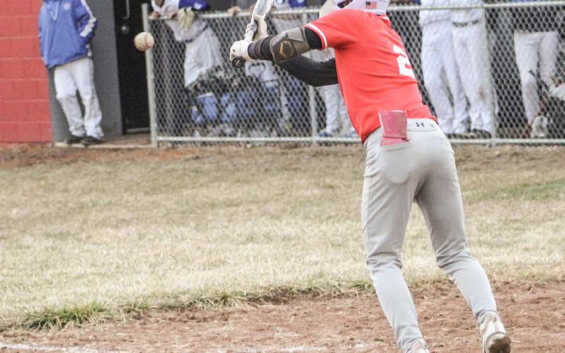 Beaverton’s Sean Barta puts down a successful suicide squeeze bunt during Friday’s doubleheader sweep of visiting Oscoda.