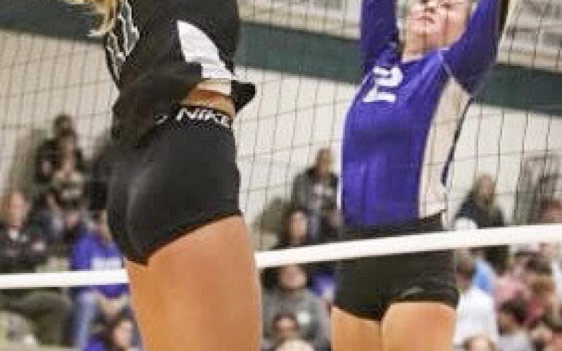 Lizzie Haines goes for the block during Gladwin’s three-set victory at Clare.