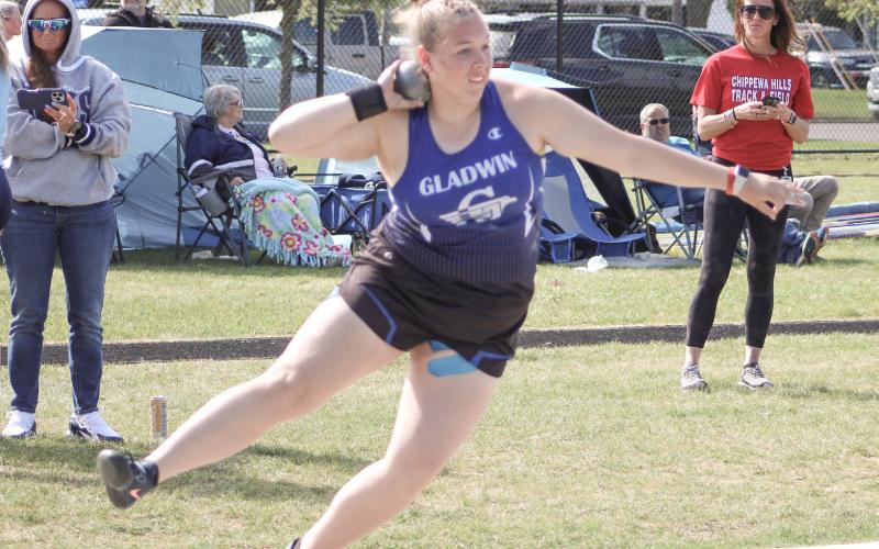 Gladwin’s Makenzie Price puts the shot a school record distance of 42’10.25” to win the gold medal at Cadillac’s Division 2 regional Friday.