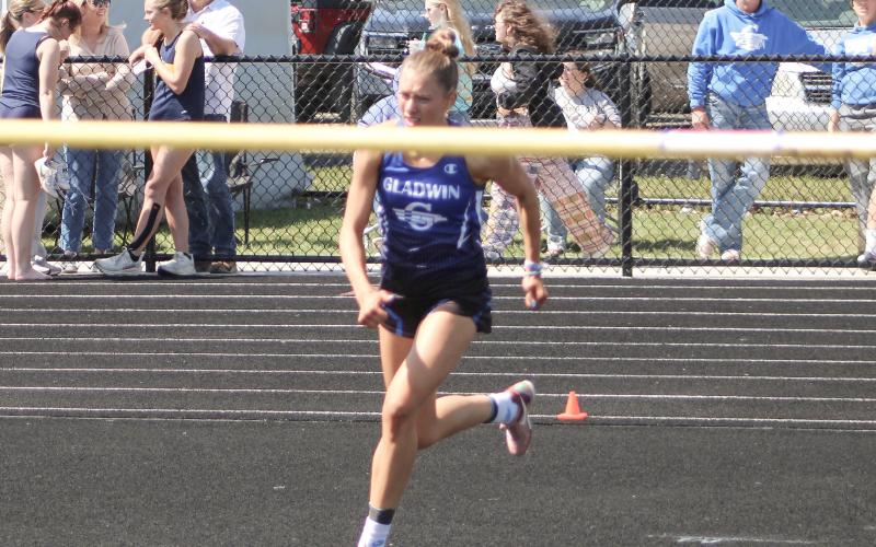 Gladwin’s Bree Visser approaches the bar on her way to qualifying for the state meet in the high jump at Friday’s regional.