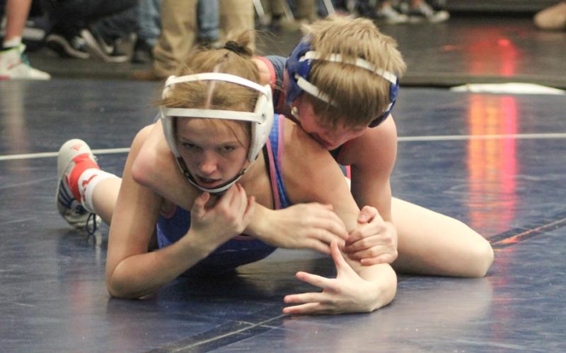 Gladwin’s Tricia Pyrzewski tries to break the grip on her way to a 4-1 record at Saturday’s dual meet tournament.
