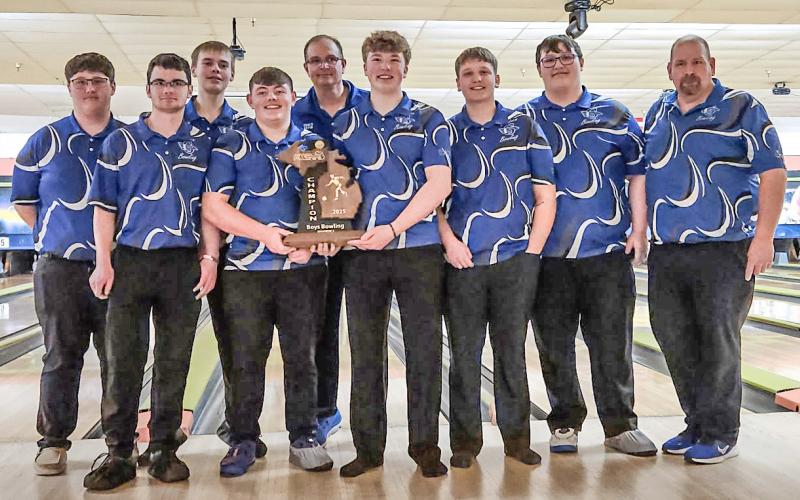 Gladwin’s boys’ bowling team poses with its trophy after winning the regional championship last week to advance to the state finals.