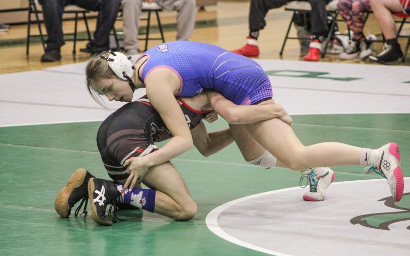Gladwin’s Lily Miller sets Beaverton’s Hunter Rumsfelt up for a pin during their match at 113 at last Wednesday night’s dual meet at Clare.
