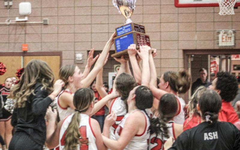 Beaverton’s Trinity Danielak launches another 3-pointer during Friday night’s victory over Gladwin. The freshman made six and led all scorers with 29 points as the Beavers grabbed the Cedar Cup (inset).